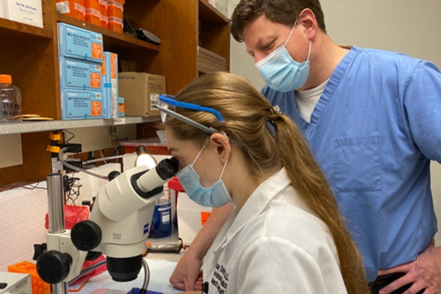 Lindsay Davison and Dr. Jonathan Brown in the lab at Vanderbilt