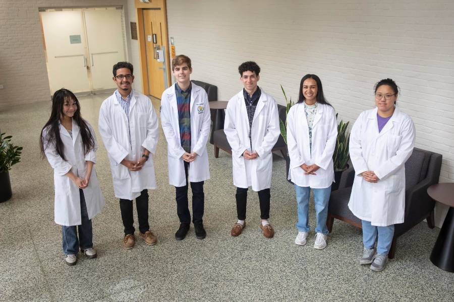 The 2021 Langford-Yates Summer Research Fellows standing in McFarland. From left to right: Madeleine Phan, Matthew Khalil, Pedro Gallardo, Markous Boushra, Alexus Brown, Beth Nguyen