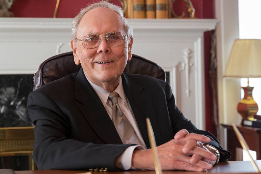 Dr. Carl McKelvey sitting at his desk in the Center for Spiritual Renewal