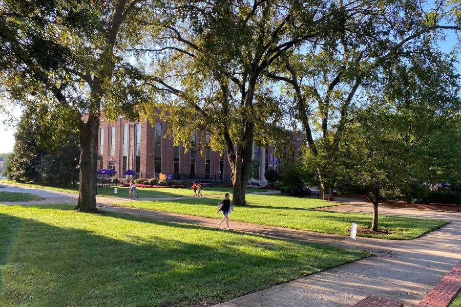 Photo of student walking across the Lipscomb campus