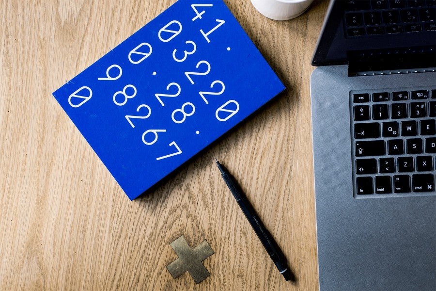 Calculator and computer on desk