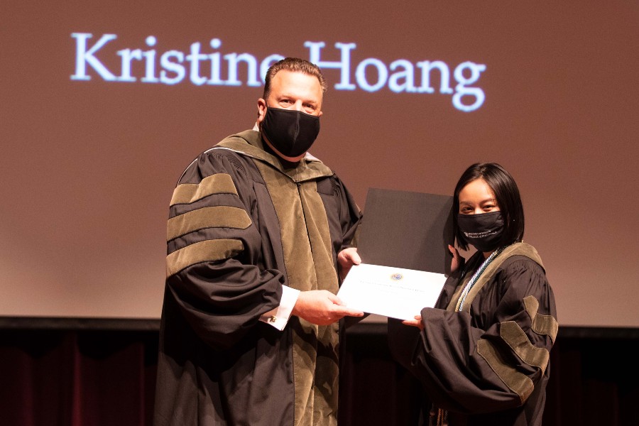 Kristine Hoang receiving her award