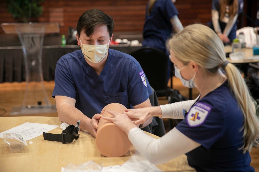 Nursing students practicing emergency wound care