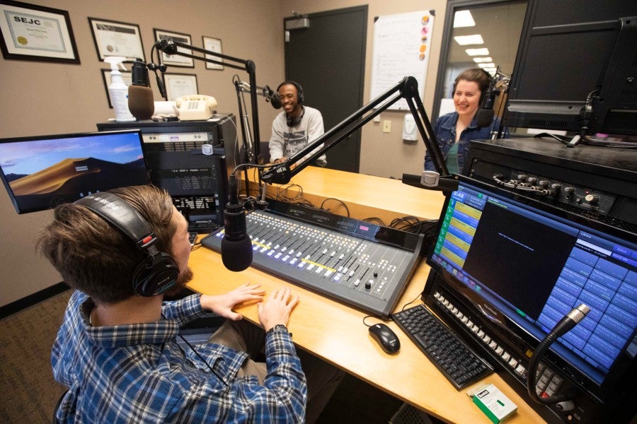 Danny Kotula (center, foreground), Kahwit Tela (Left), and Lily Corley (Right)