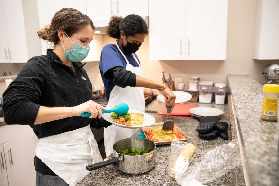 Health science students cooking a meal in the course