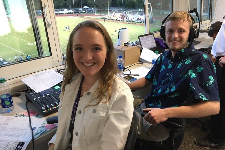 Erika Plunkett in football broadcast booth.