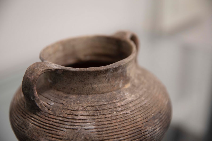 Pot with handles dug up from the ground