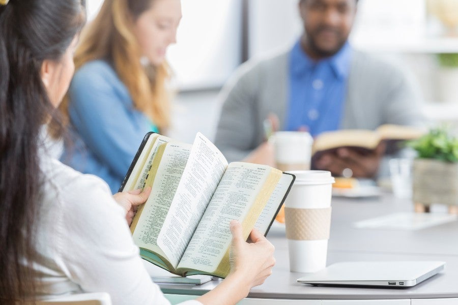 Student reading Bible