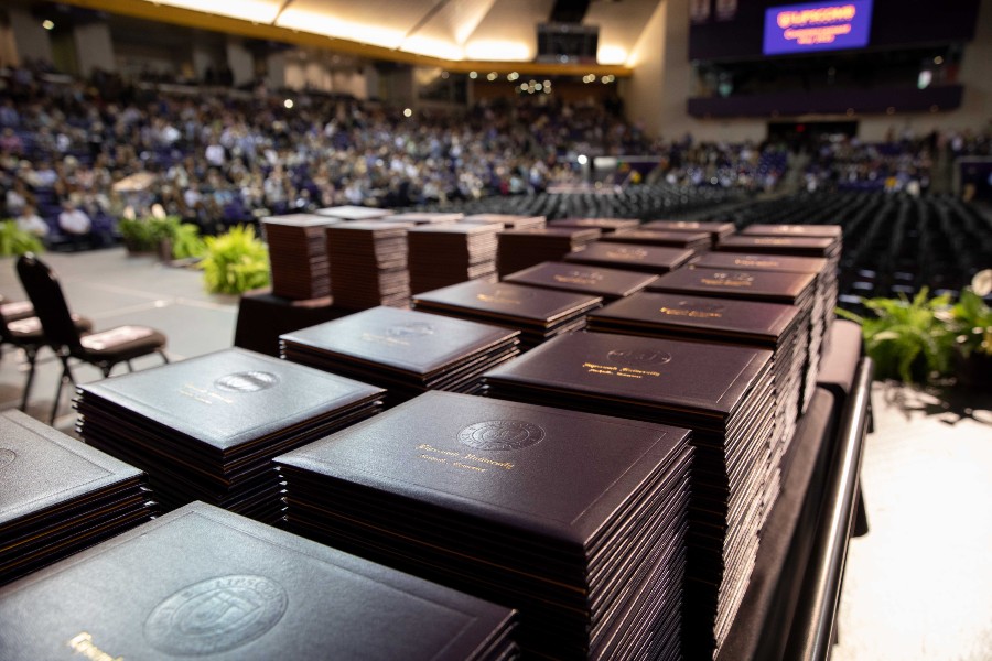 Degree portfolios on the table at commencement