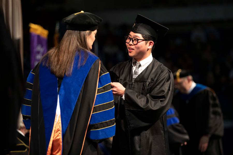 Daniel Youn receiving diploma