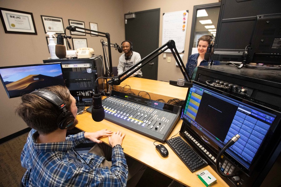 Students recording a podcast in the on-campus studio