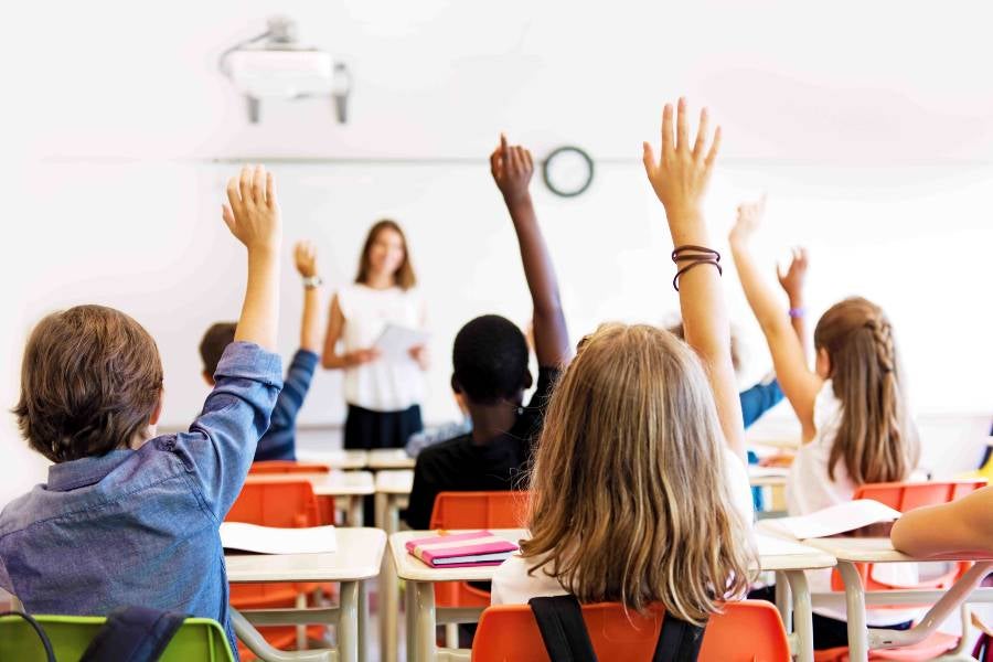 Students in a classroom with a teacher