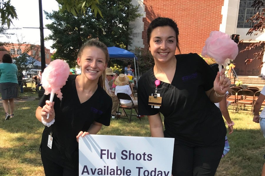 Hannah Peterson (right) at a flu shot clinic