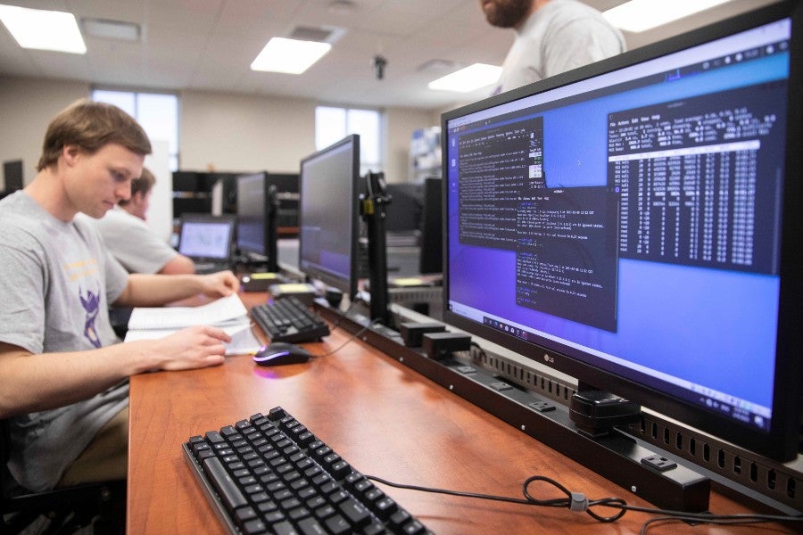 Students in the cyber security lab practicing for the contest