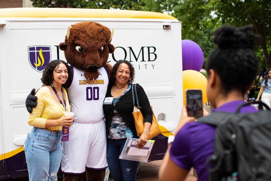 Student and her mom with the Bison in Bison Square. 