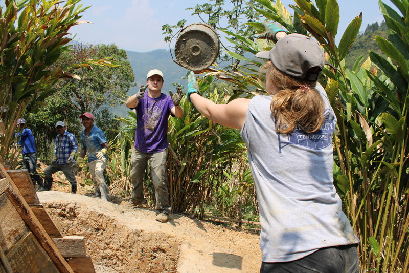 The Guatemala (Eng) Team Members Work With Locals to Pour Concrete