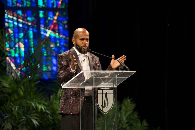 Orpheus Heyward speaking from the podium at event on Lipscomb's campus