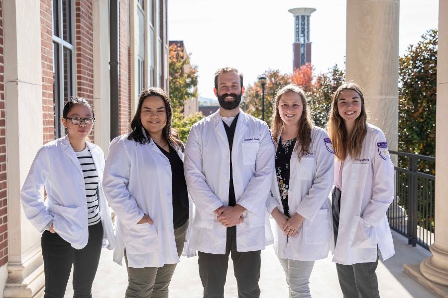 Pharmacy students standing outside