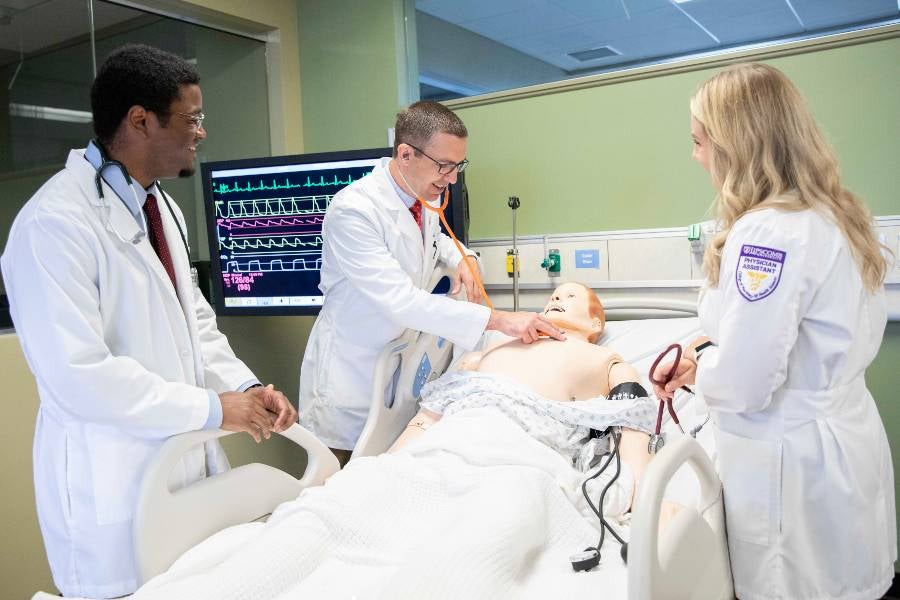 Students in a School of Physician Assistant Studies lab. 