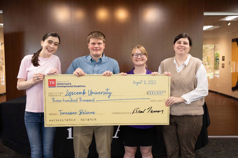 IDEAL students with grant check