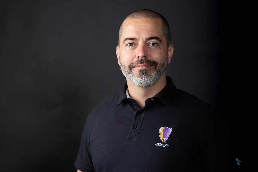 Jeff in an individual photo of himself in a Lipscomb polo.