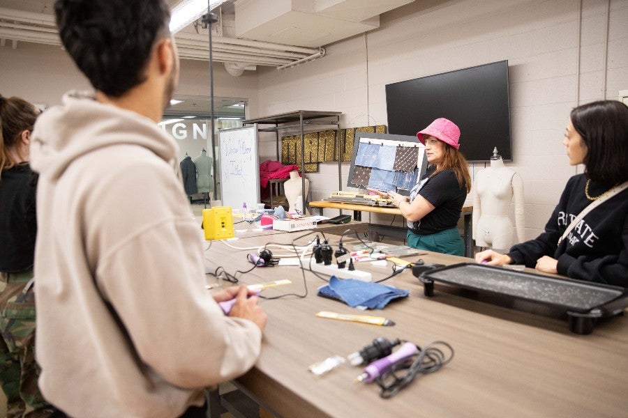 Fashion students working on material for the Dolly Parton Exhibit