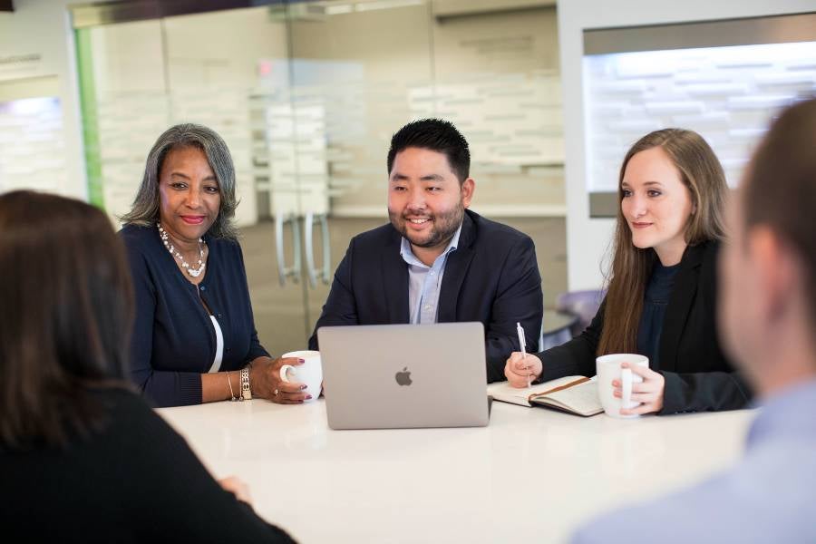 Three business people in a meeting