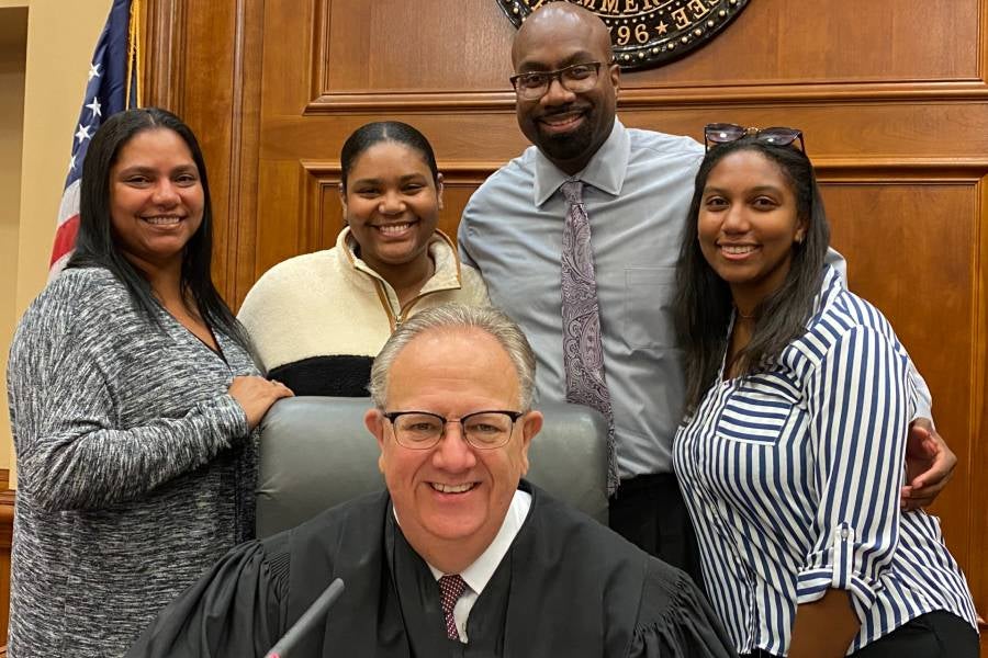 Baylis, second from left, at her adoption ceremony on Nov. 2, 2021.