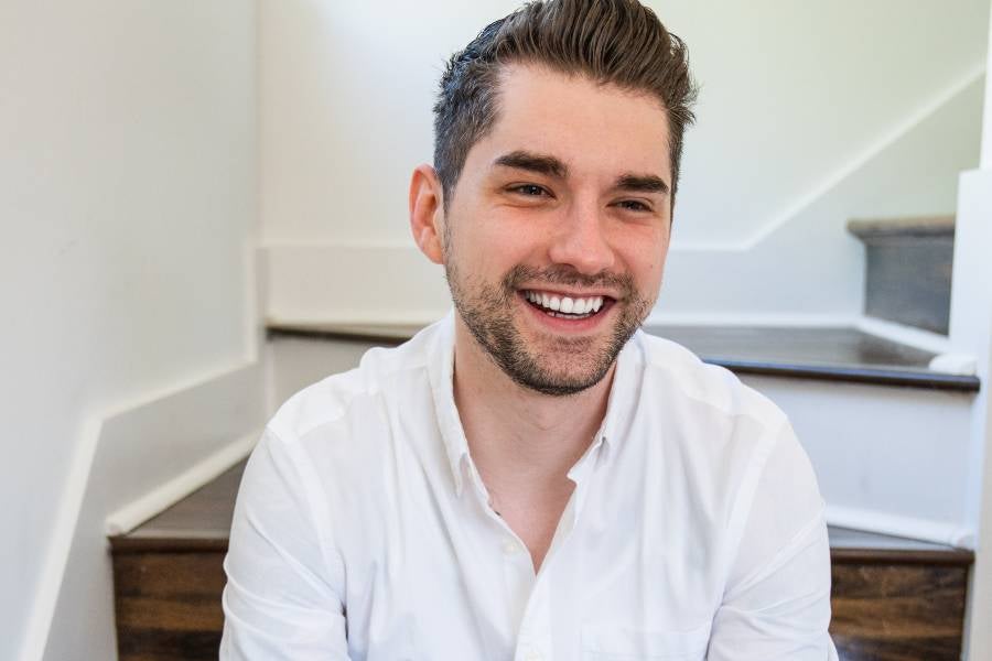 Ryan Pavlovic sitting on stairs.
