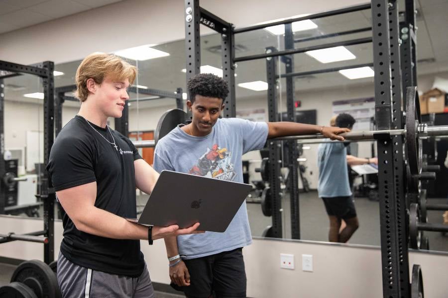 A sport analytics expert works with athlete.