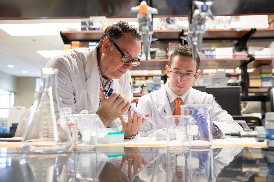 Dr. Scott Daniels with master's student Lino Gaglio.