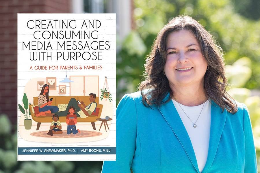 Jennifer Shewmaker with a copy of her book