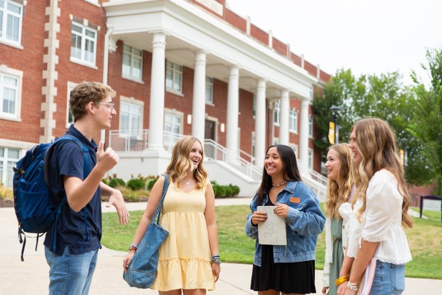 Photo of students in front of Elam Hall.