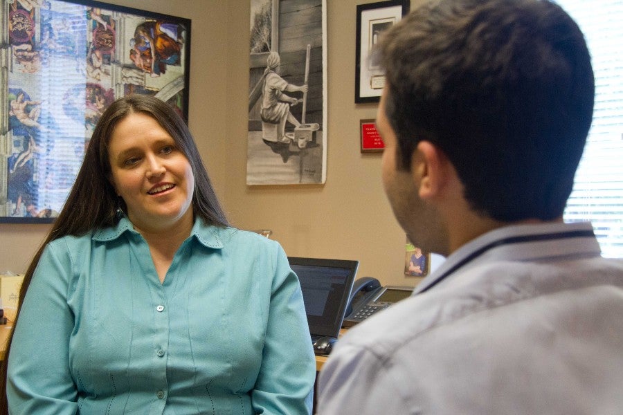 Shanna Ray talking with a man.