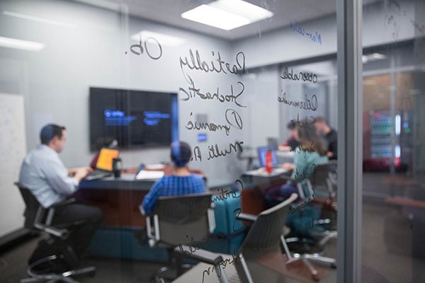 Students study together in a computer lab