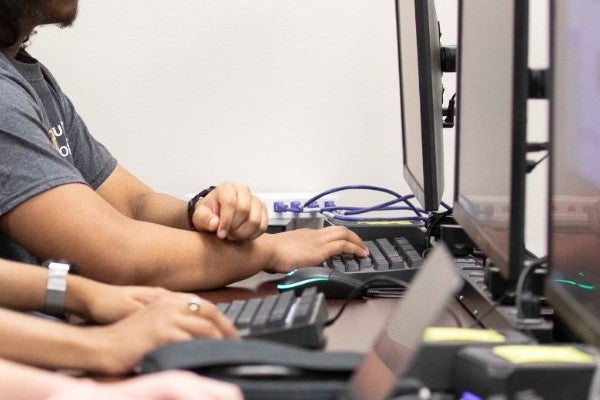 Two students at work in the school of computing