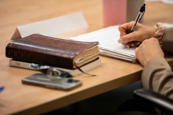 writing in a notebook