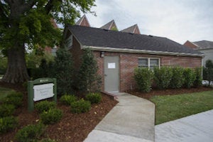 building with sign in front