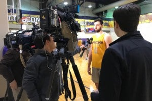 Bison basketball player Rob Marberry talking to reporters. 