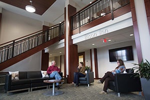 Guests sit downstairs in the common area of the Bison Inn.