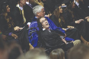 Lavender and Walker sit at commencement