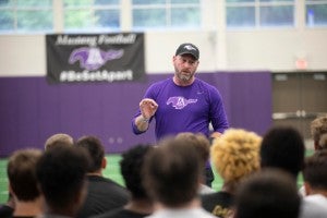 Trent Dilfer talking to football players