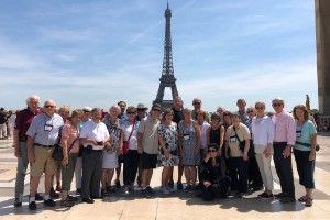 Lifelong learning group standing in front of Eiffel Tower