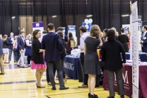 Booths with people visiting them 