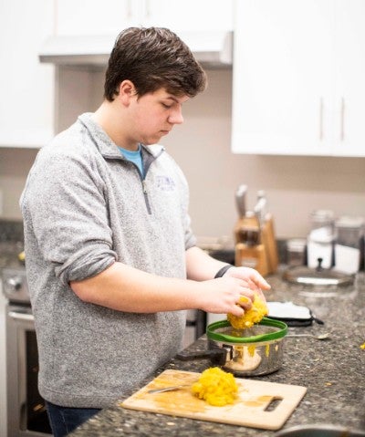 Student pureeing a pumpkin.