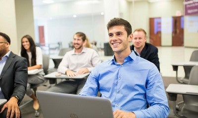 Students sitting at desks in a classroom