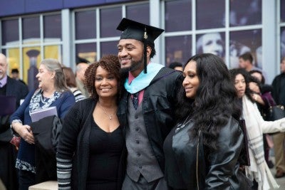 Graduate and family taking a picture