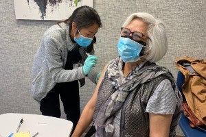 Pharmacy student giving Covid vaccine