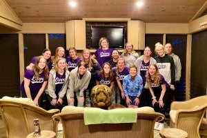 Robbie Davis with athletes at her home