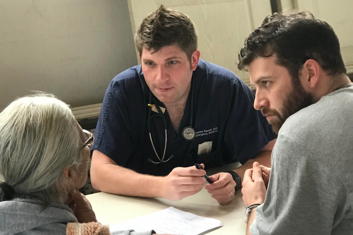 Dr. James Parnell talking with a patient in Baja, Mexico